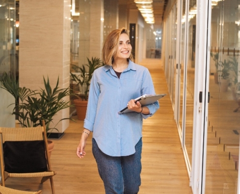 lady walking with clipboard